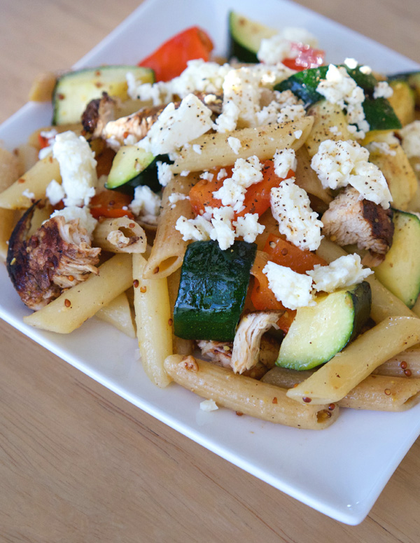 A heaping plate of penne with zucchini, red peppers, balsamic chicken and a healthy dose of feta.