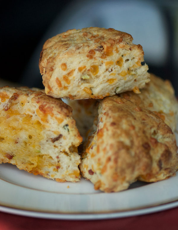 Golden scones with melted cheddar fresh from the oven