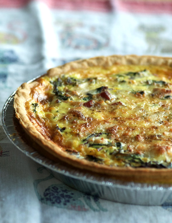 Pancetta Quiche with Parmigiano Reggiano and Swiss Chard on linens