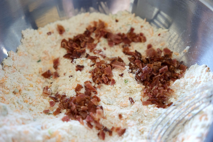 Closeup of bacon added to the dough