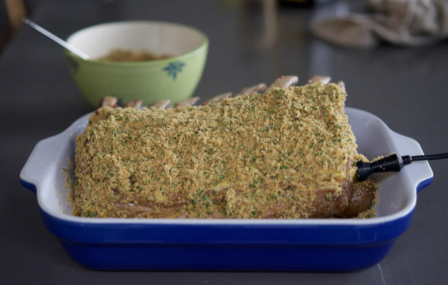 Use mustard to help breadcrumbs adhere to the lamb
