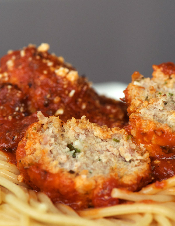 Turkey meatballs with Parmesan cheese in tomato sauce on spaghetti noodles