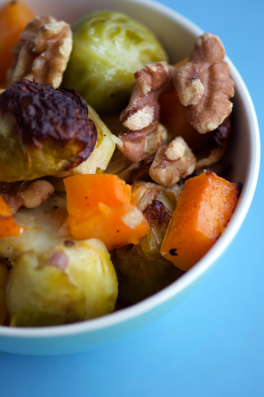 Caramelized butternut squash, brussels sprouts and apples come together with walnuts and maple syrup for a delightful veg side dish