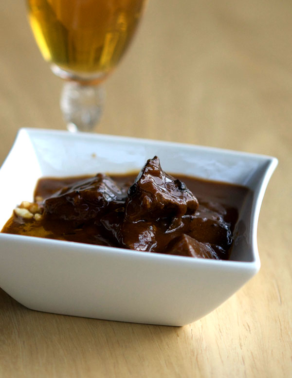 A bowl of beef goulash with rich gravy.