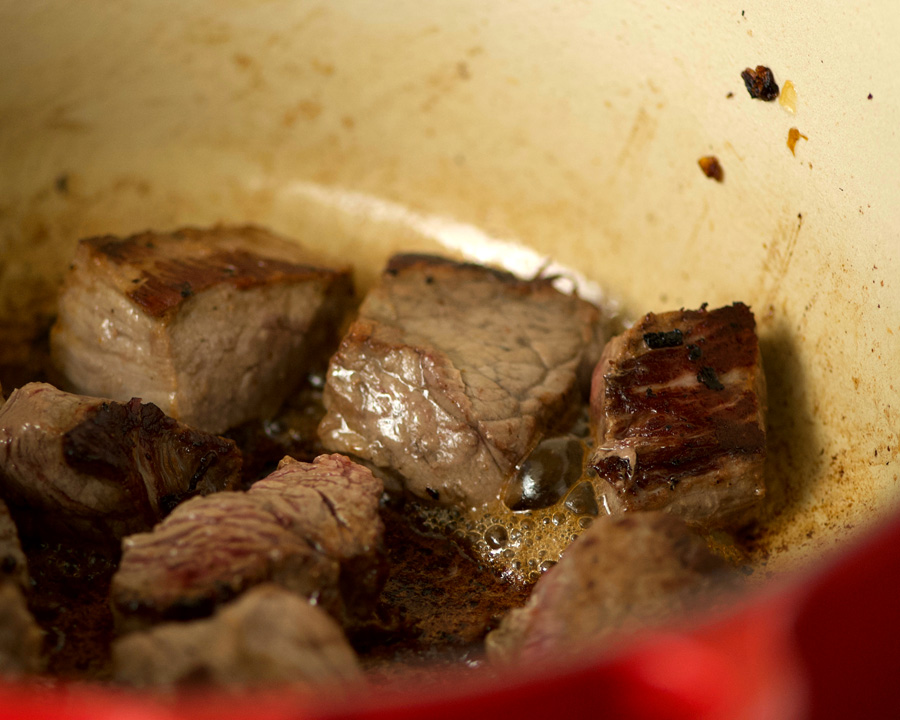 Beef browns in the pot